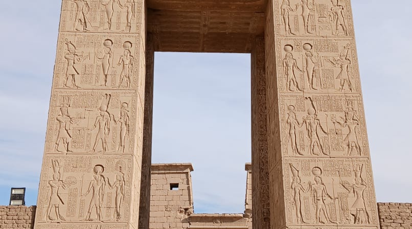 Massive stone gateway at the entrance of the Temple of Khonsu within the Karnak Temple Complex in Luxor, Egypt.