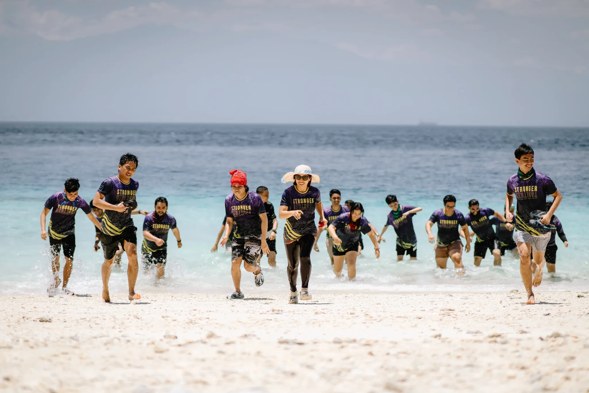 Hero image of Goodfrontend team running on the beach