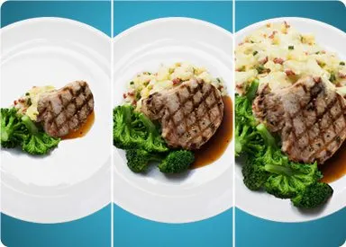 A white plate with a grilled steak, accompanied by a side of broccoli and a creamy-looking rice dish, set against a teal blue background.