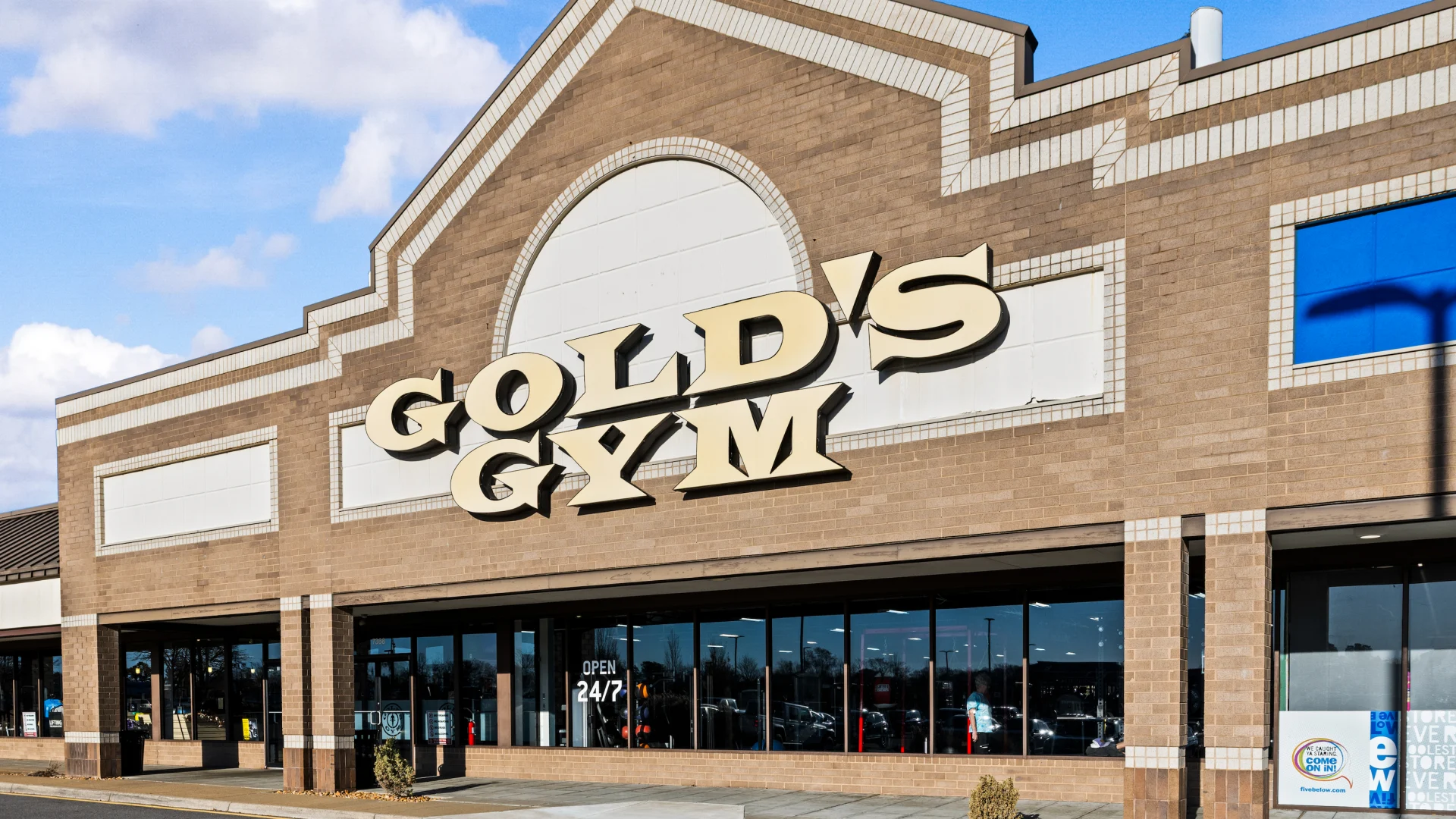 Exterior front view of Gold’s Gym building.