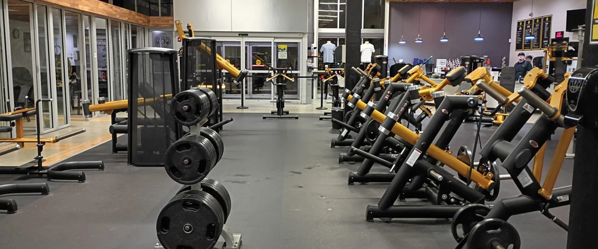 Rows of plate loaded gym machines in the fitness area at Gold’s Gym South Texas in Harlingen.