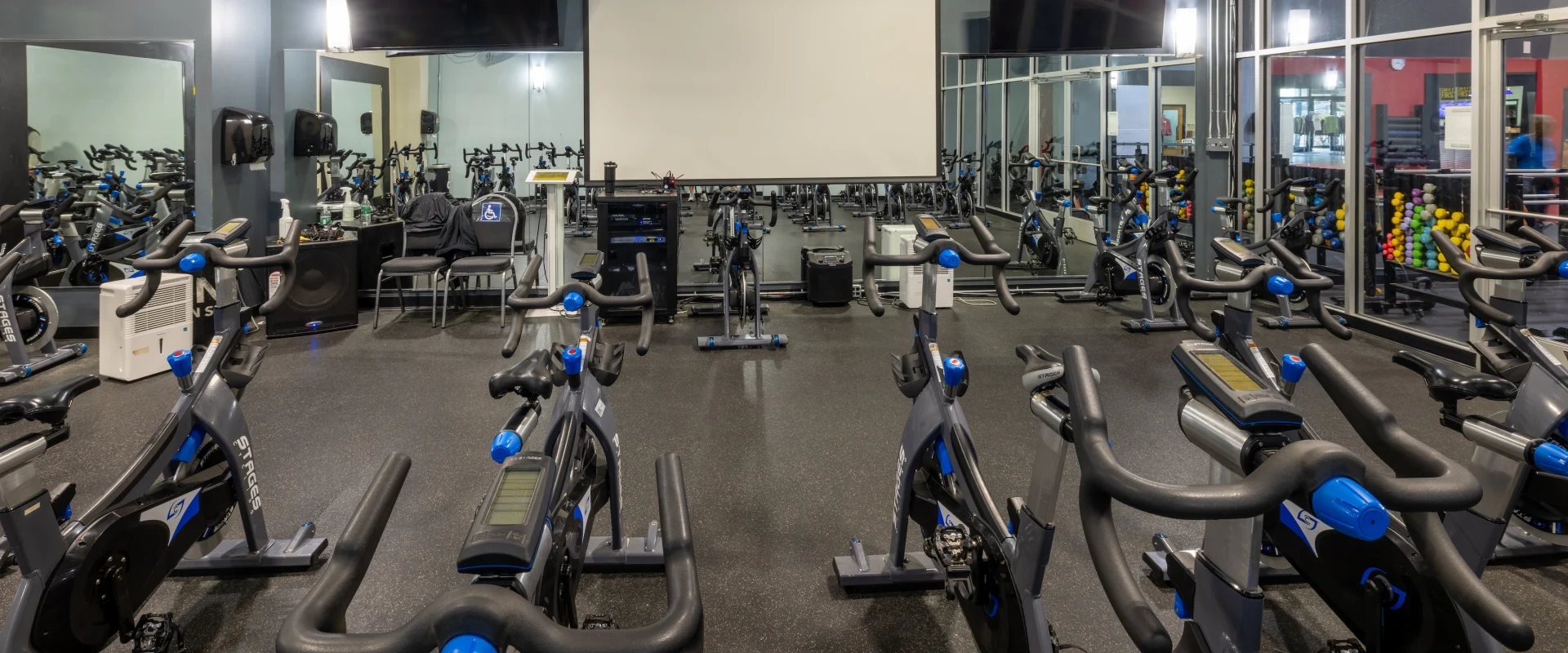 Bikes in cycle studio with screens