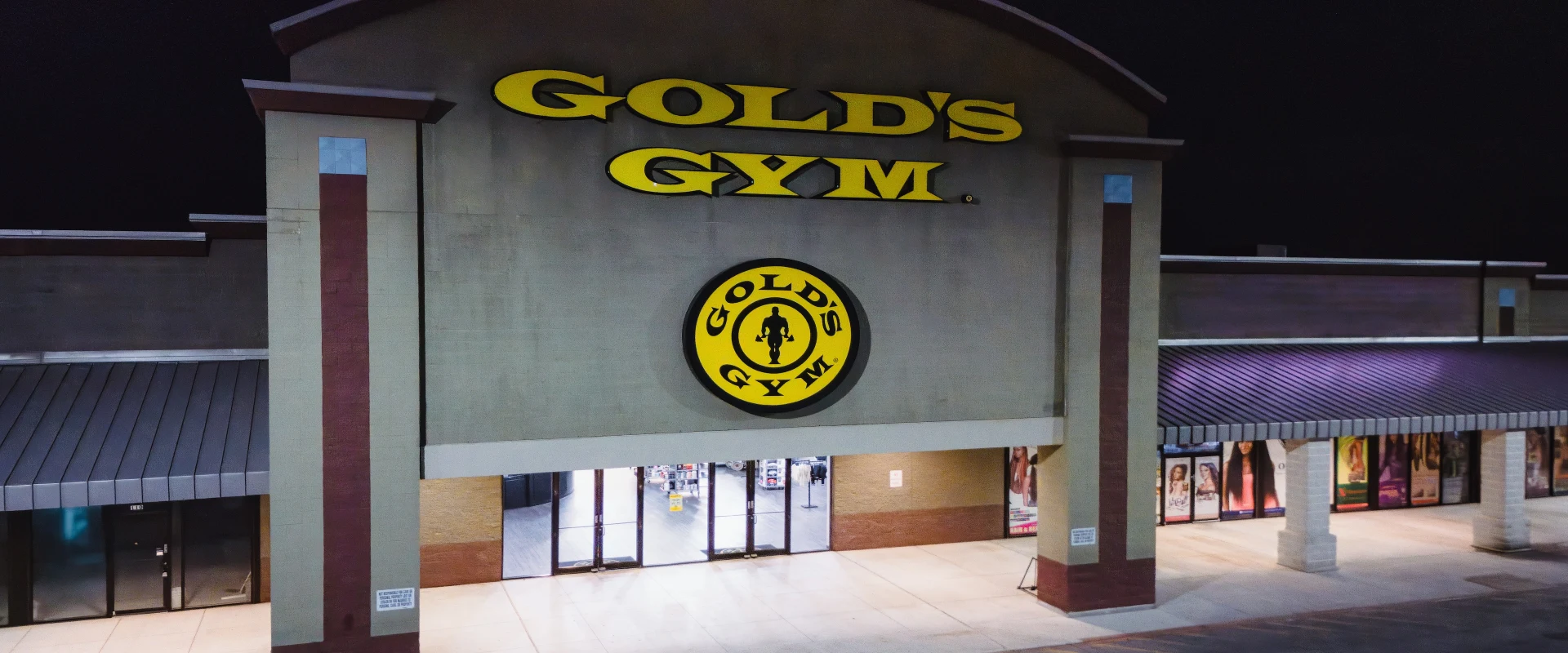 Exterior night view of Gold’s Gym 78 Walzem location with illuminated signage.