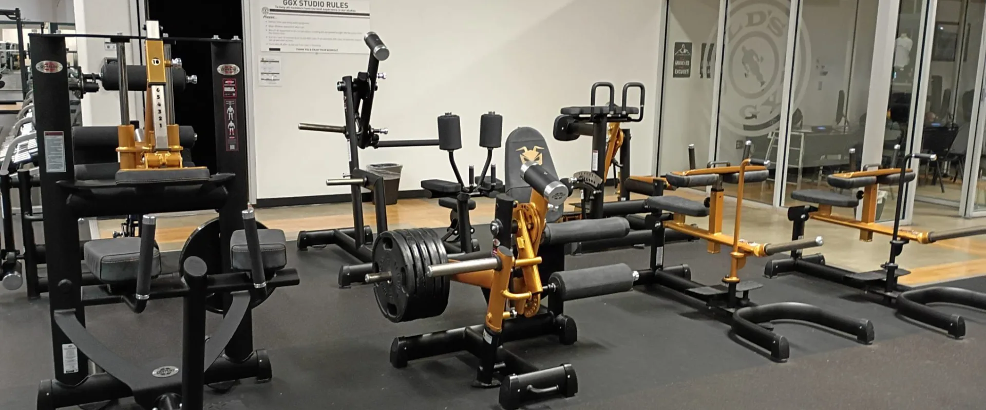 Strength training area with multiple resistance machines at Gold’s Gym South Texas in Harlingen.