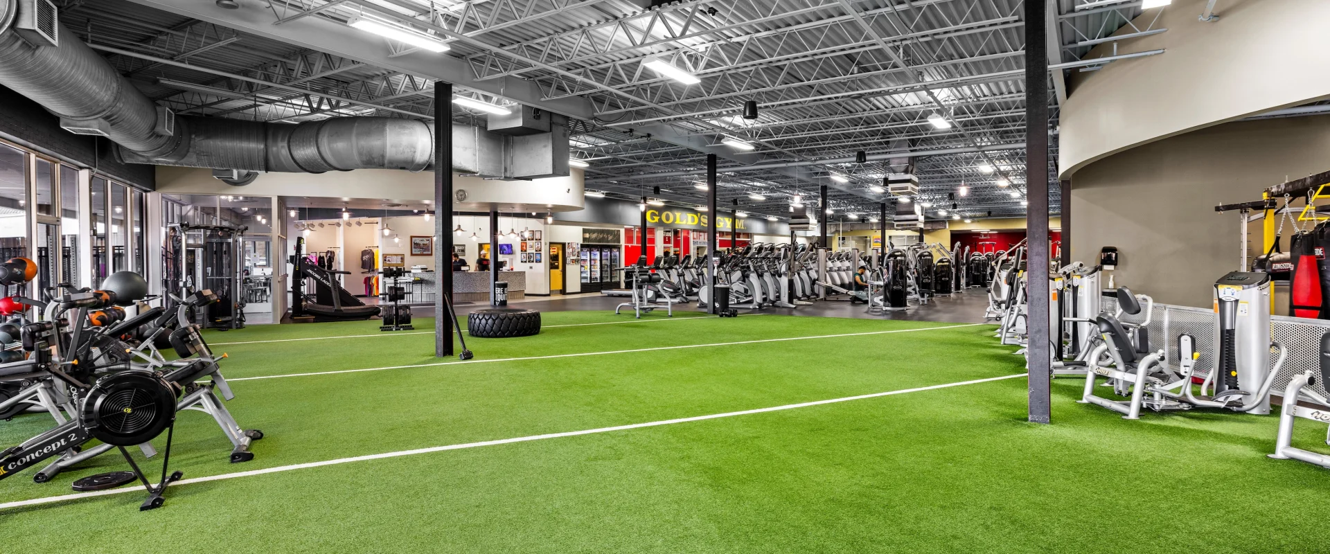 Turf showing front desk and cardio area.