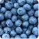 A close-up view of a pile of fresh, plump blueberries with a slightly blurred background.