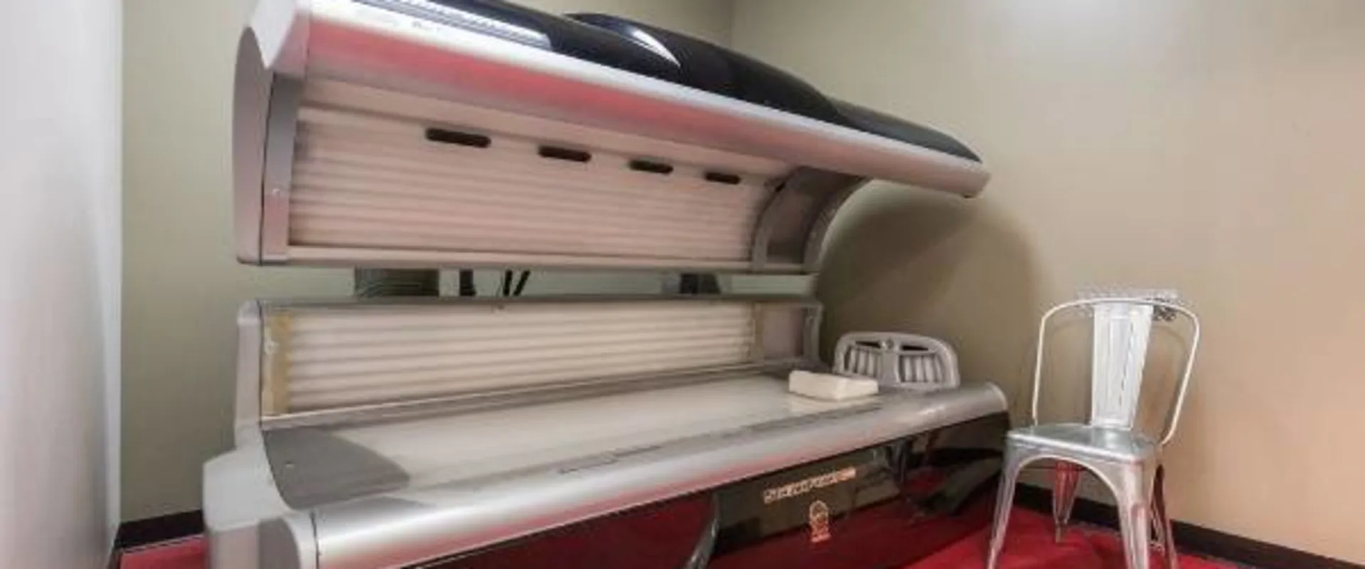 Modern tanning bed in clean gym room