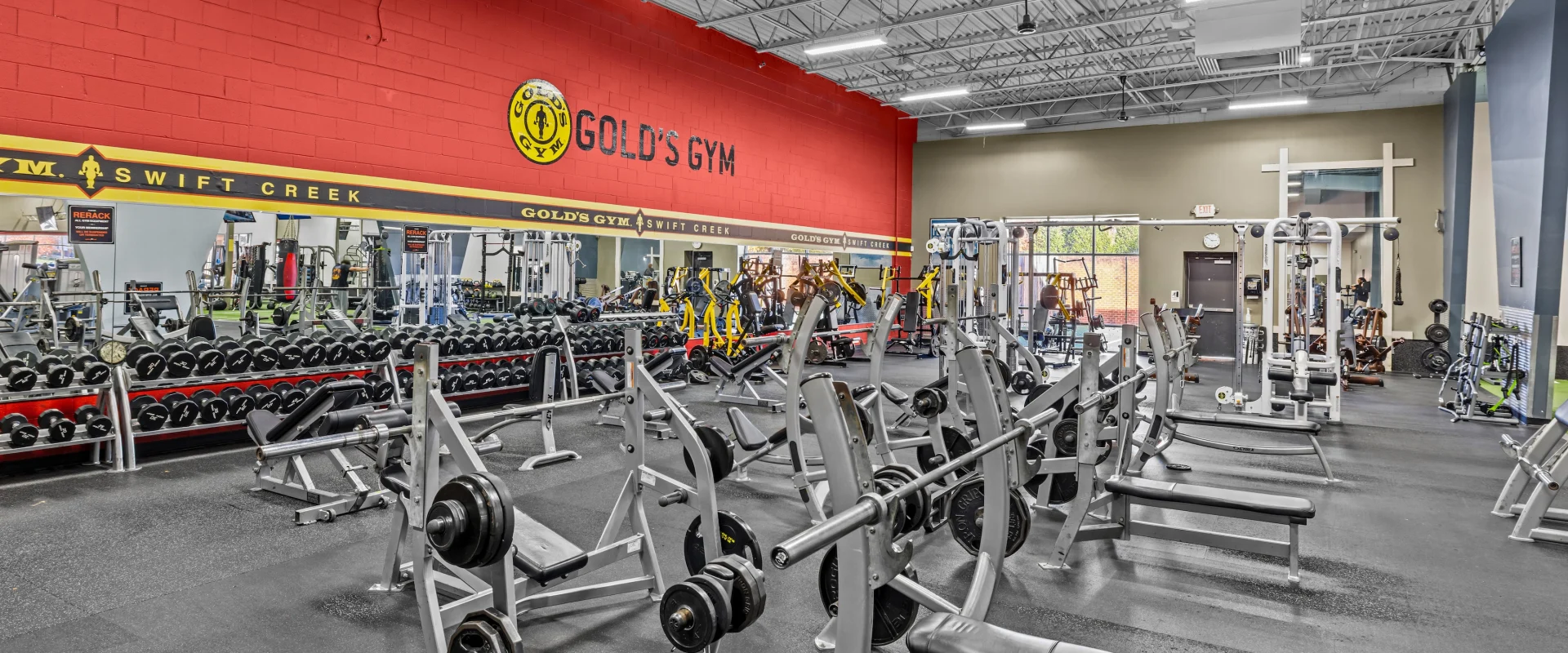 Back of the gym in the free weights area