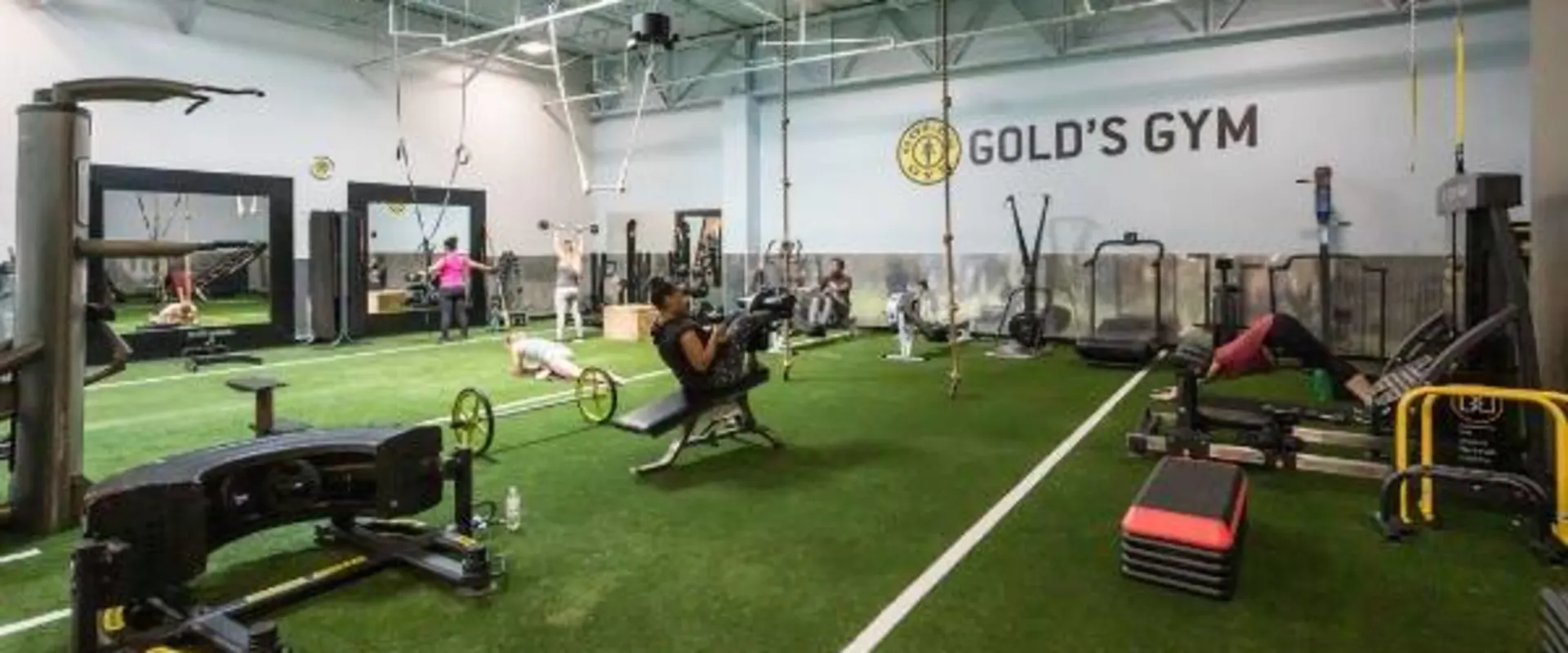 open weight room with turf in will lawn gym