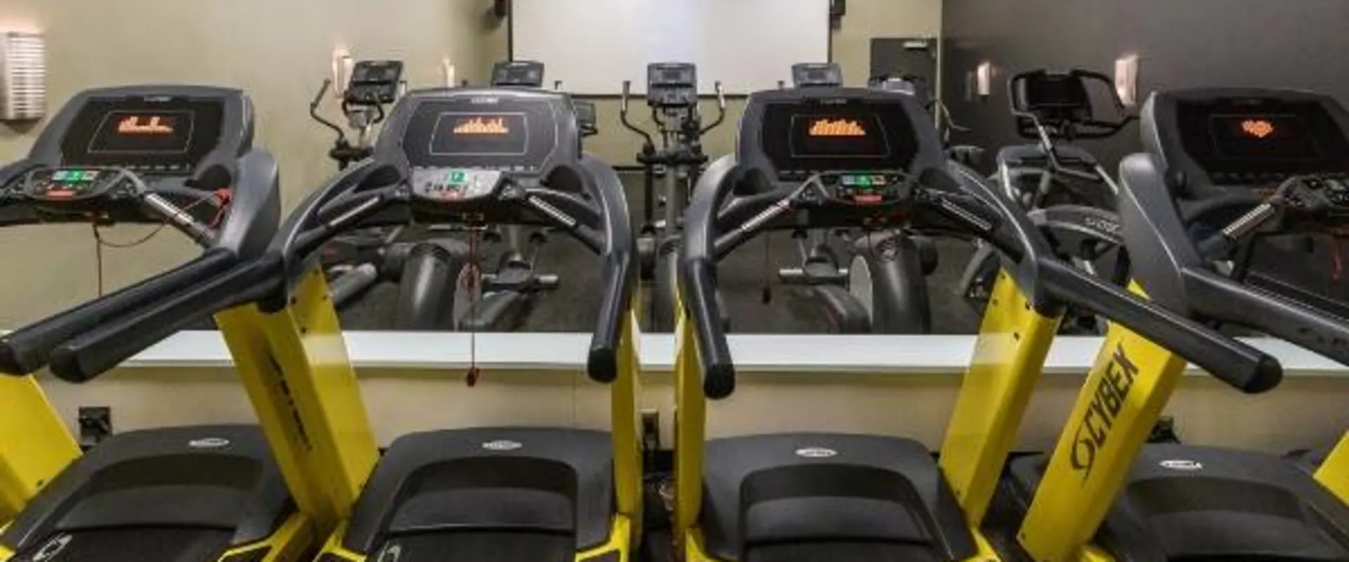 Cardio equipment in expansive theater at best gym near me