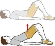 The image depicts a person lying on the ground, with their legs raised and supported by a wall or other surface. The person appears to be performing a leg raise exercise or stretch.