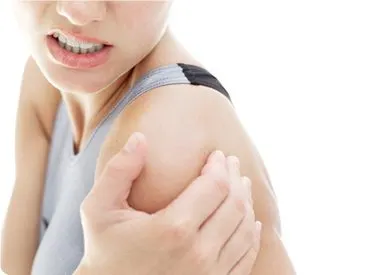 A close-up view of a person's face, with the focus on their shoulder and arm, revealing a portion of their upper body.