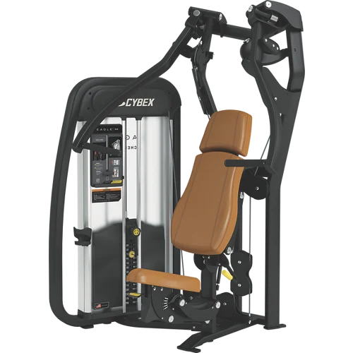 This image depicts a piece of exercise equipment, specifically a shoulder press machine. The machine has a black frame and various adjustable components, including a padded seat and handles for the user to grip. The background appears to be a gym or fitness facility setting.