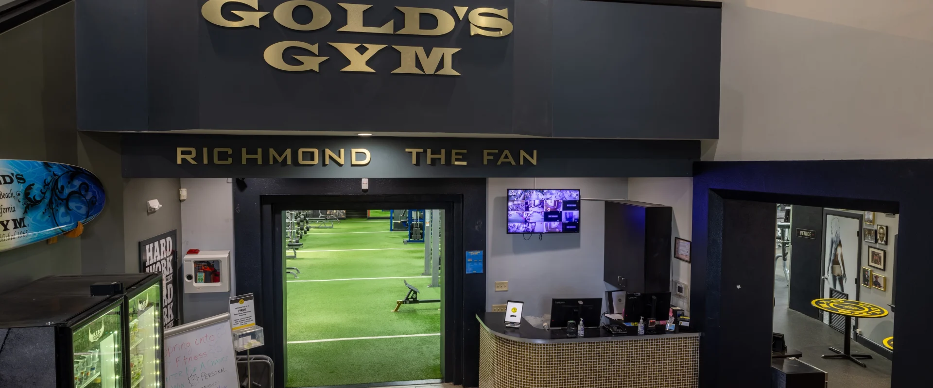 Lobby and front desk, displaying a little bit of the turf and upstairs area.