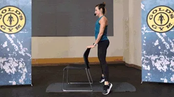 Woman does squat heel lift during chair workout