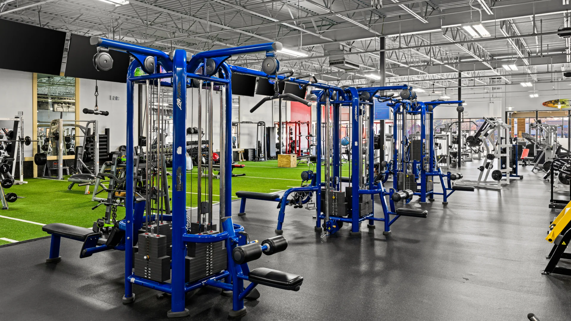 Cable machines and indoor turf training area.