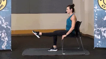 Woman does leg circles during chair workout