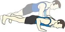 The image depicts two individuals engaged in a wrestling or grappling maneuver, with one person on top of the other in a prone position.