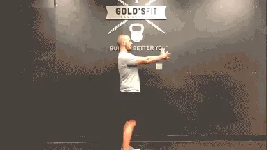 Man doing daily movement routine in the gym with a back opener stretch in the gym