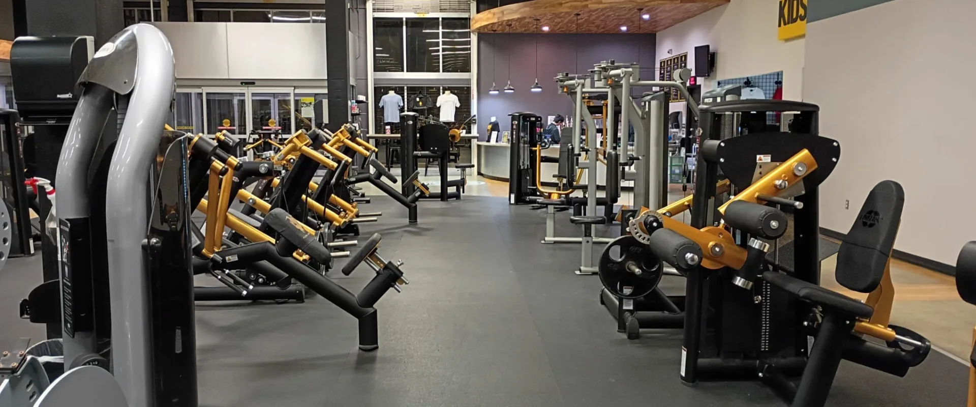Selectorized fitness machines lined up in the gym floor at Gold’s Gym South Texas in Harlingen.