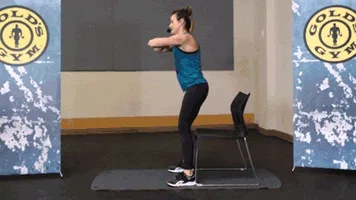 Woman does good morning squat in gym for chair workout