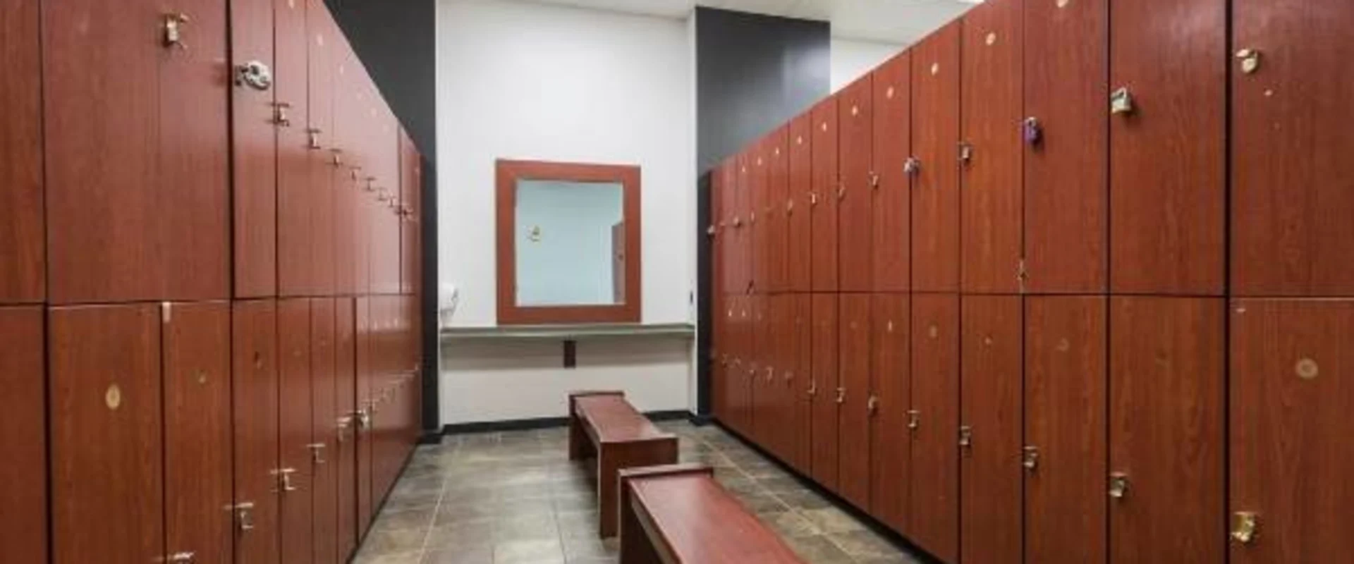 Clean wooden locker room in gym near me