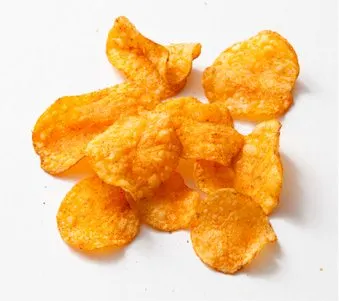 A pile of crispy, golden-orange potato chips or crisps, arranged on a plain white background.