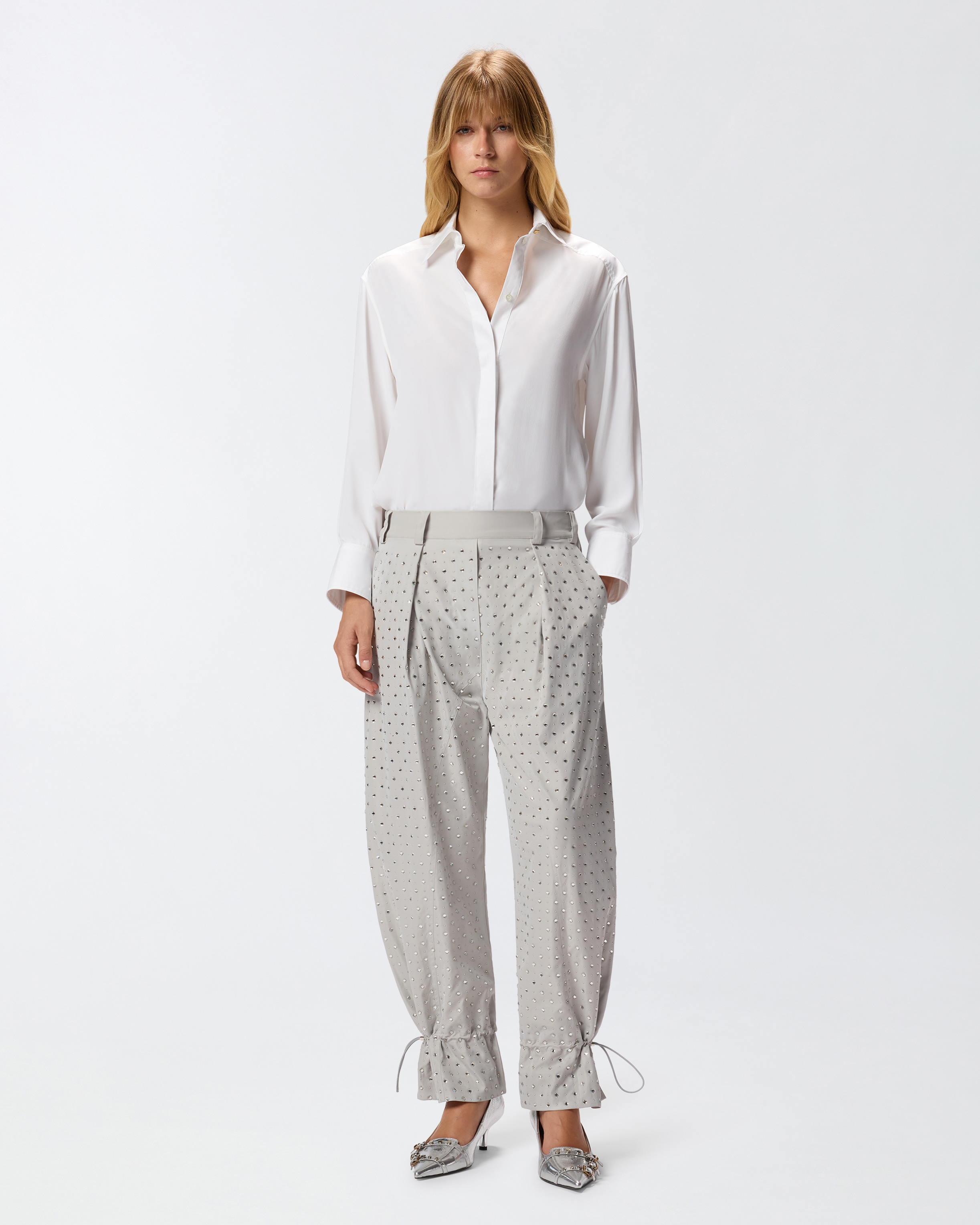 Pantalones con strass y tachuelas 0