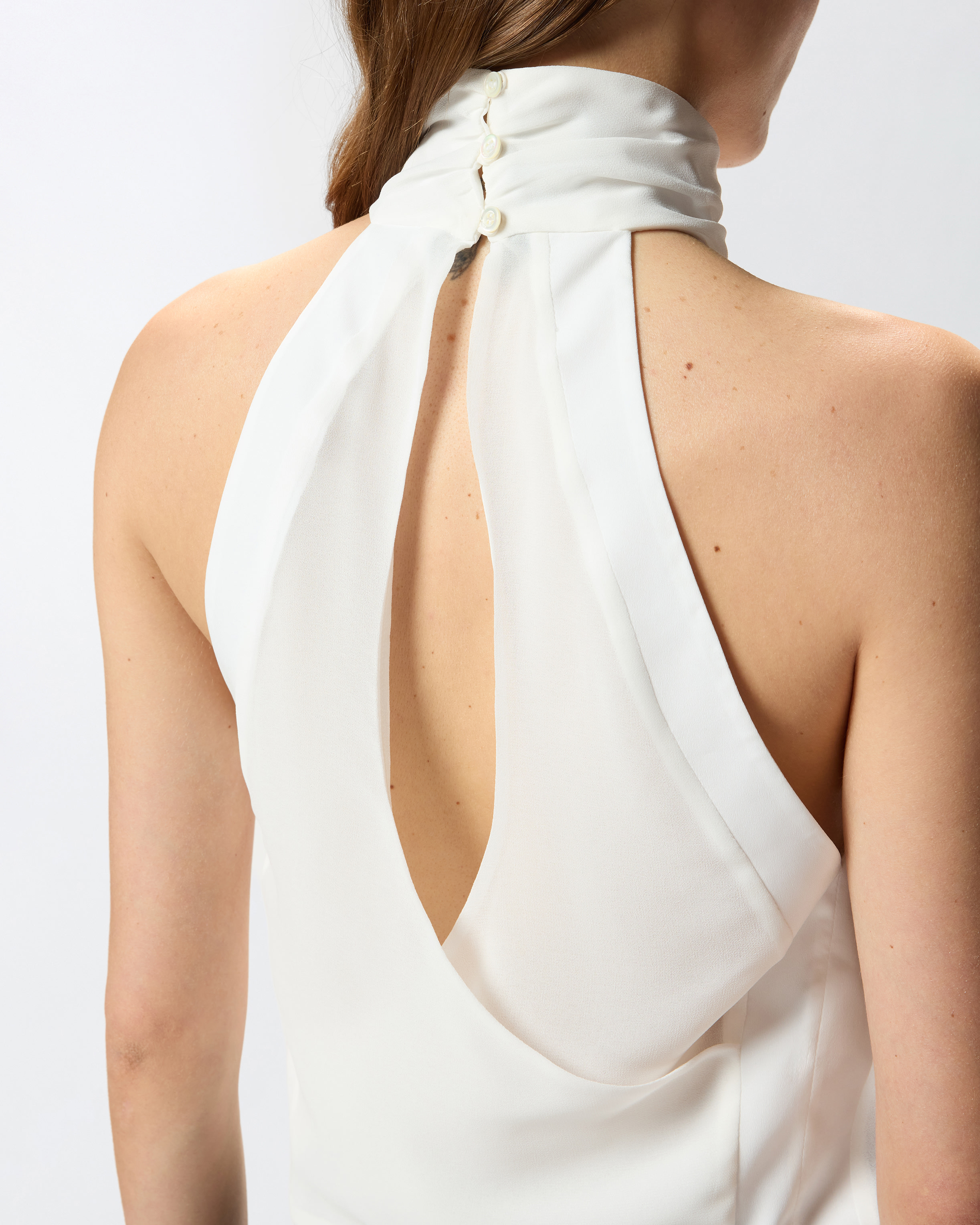 Топ с американской проймой и фигурной прорезью на спинке 3