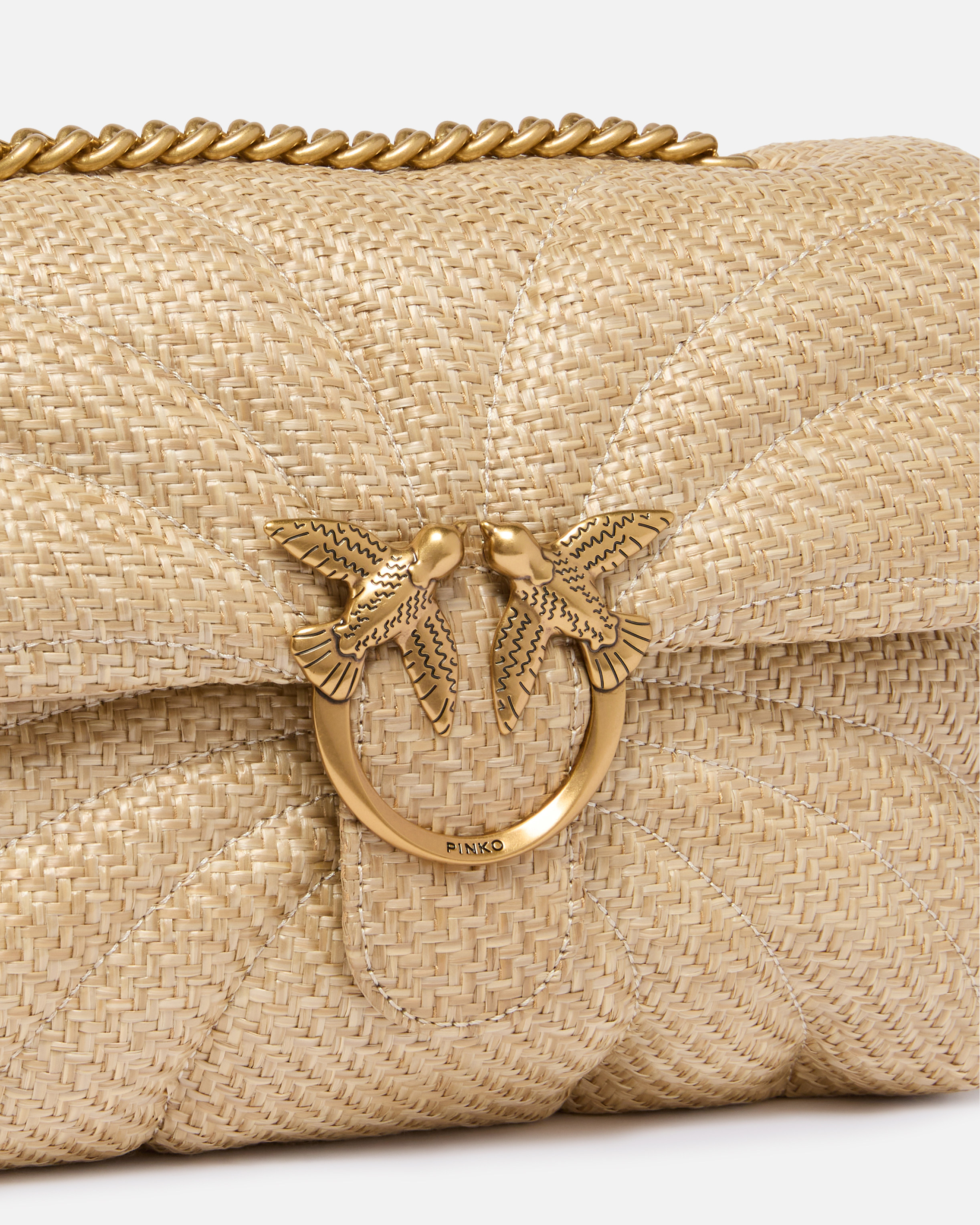 Borsa a tracolla media Love Bag Puff in rafia trapuntata con