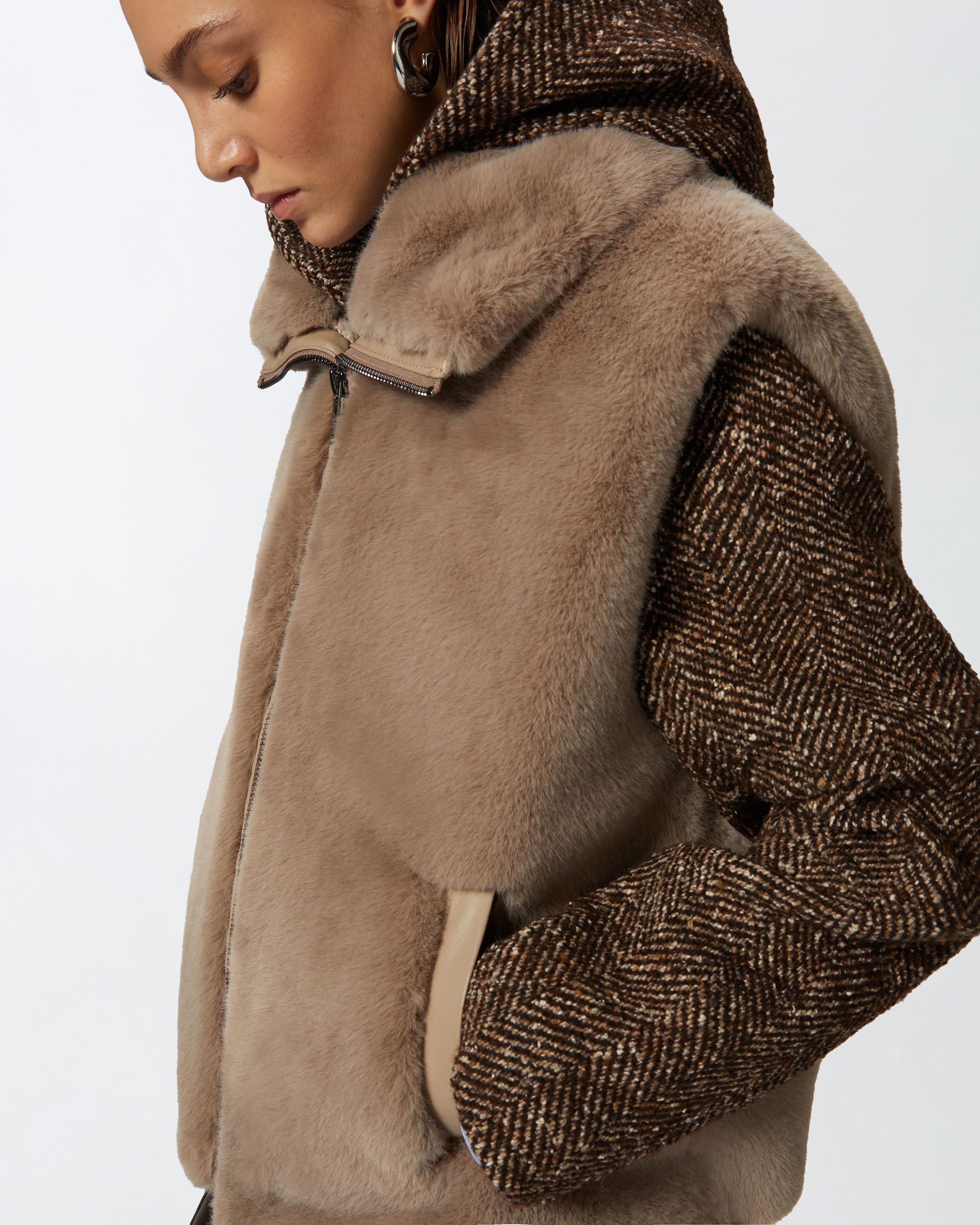 Sleeveless faux fur jacket with high collar. PINKO