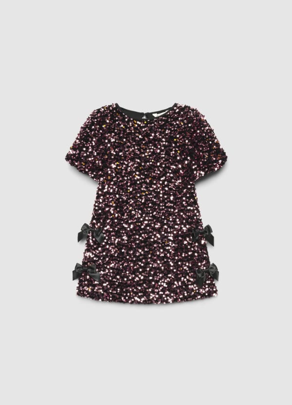 Vestito con paillettes e fiocchi laterali