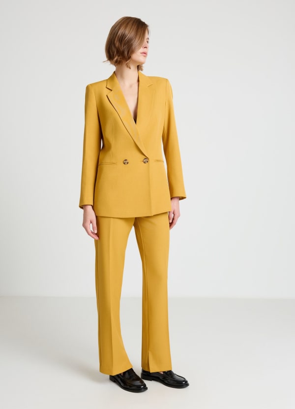 Pantaloni dritti con spacchi al fondo
