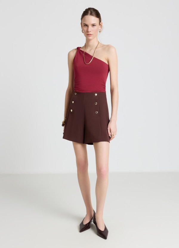 Shorts con bottoni decorativi