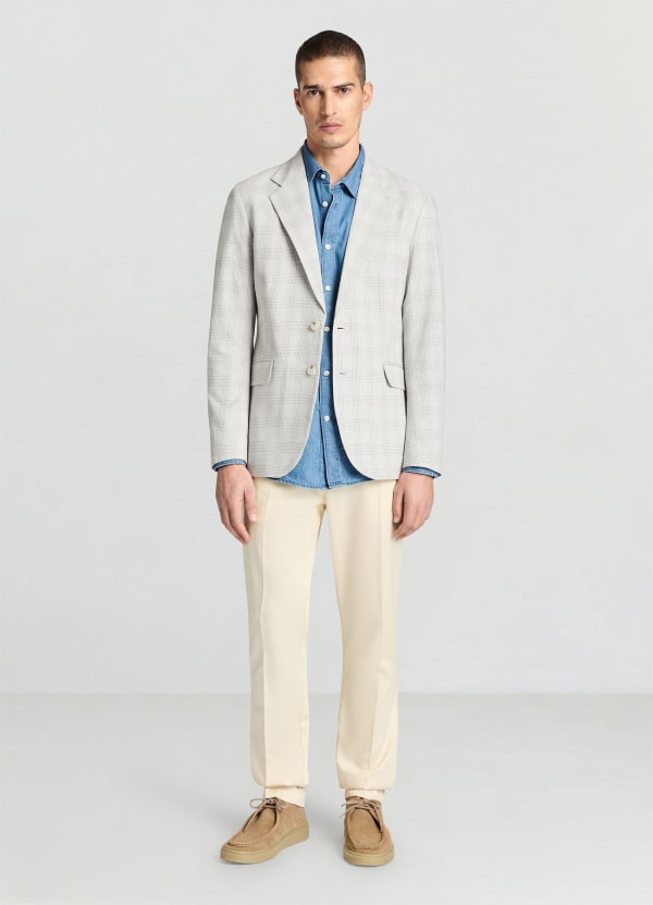Pantaloni con pinces e tasche a filetto