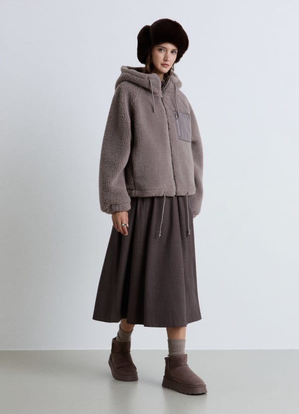 Giubbotto teddy con cappuccio e zip