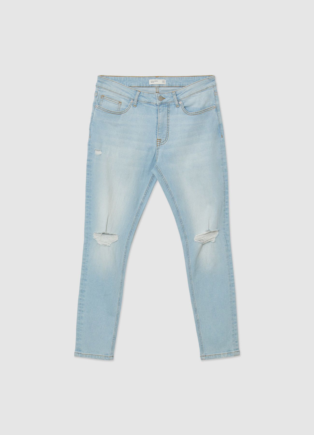 Jeans skinny slavato con strappi