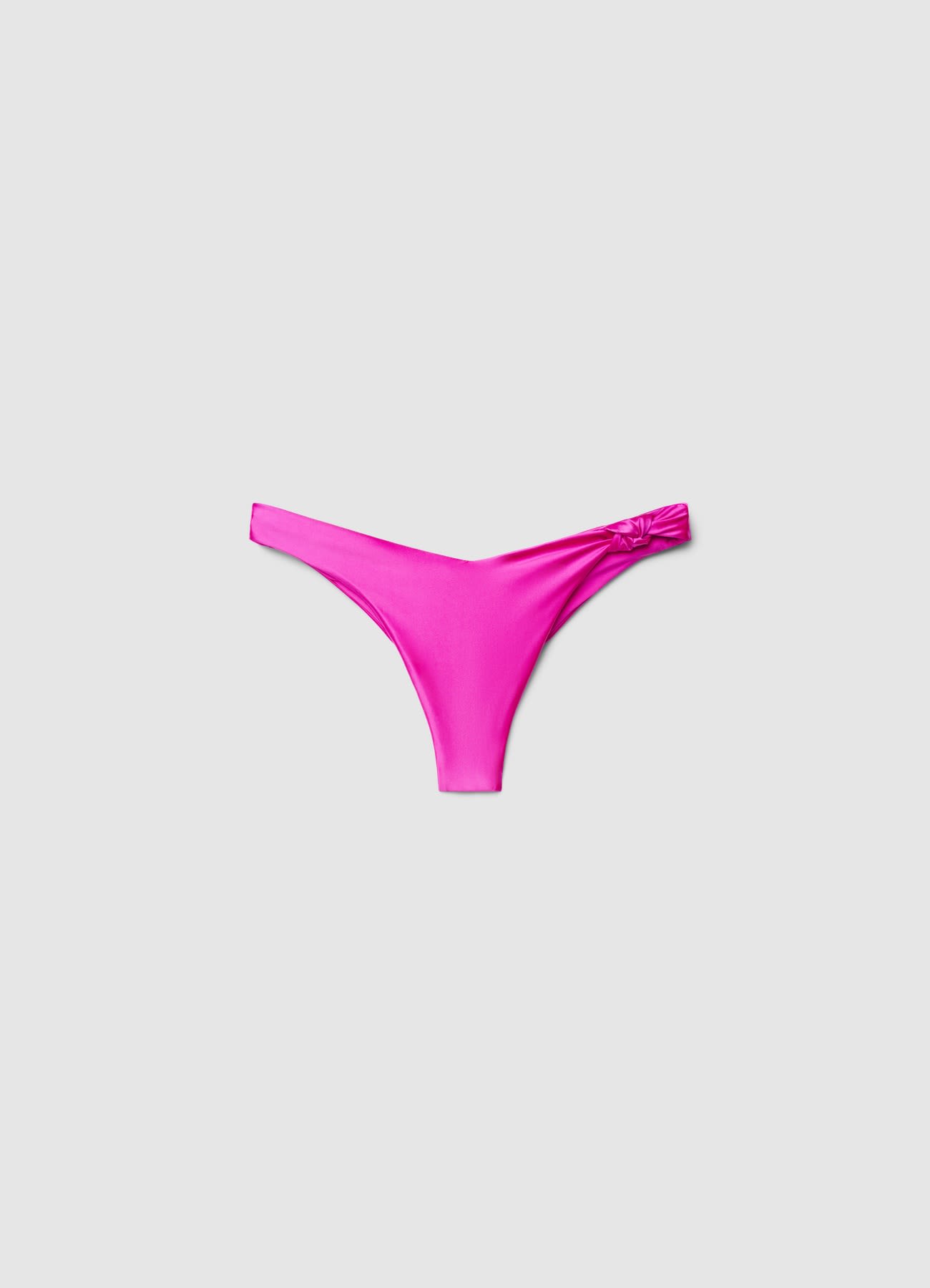 Slip bikini brasiliana con nodi a tinta unita