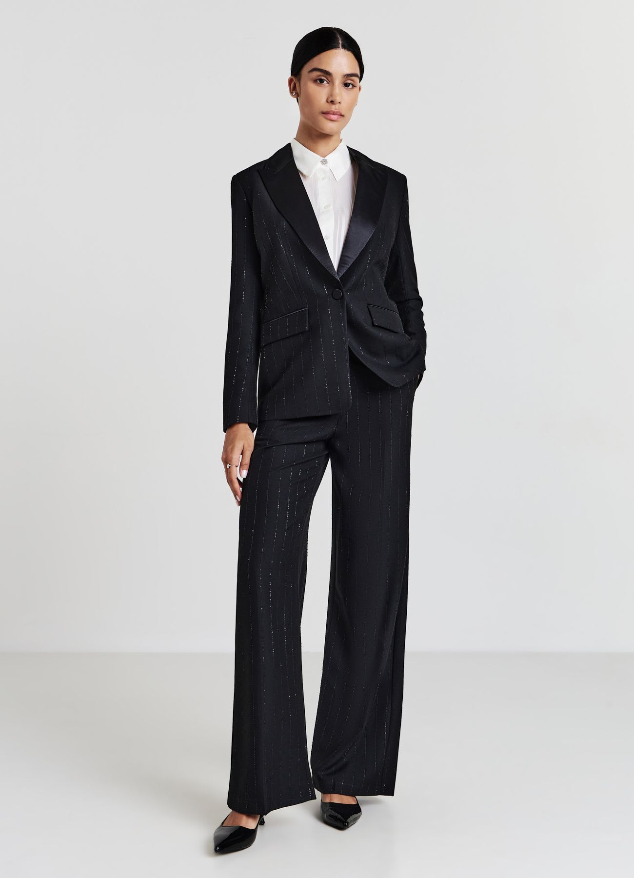 Pantaloni palazzo con paillettes