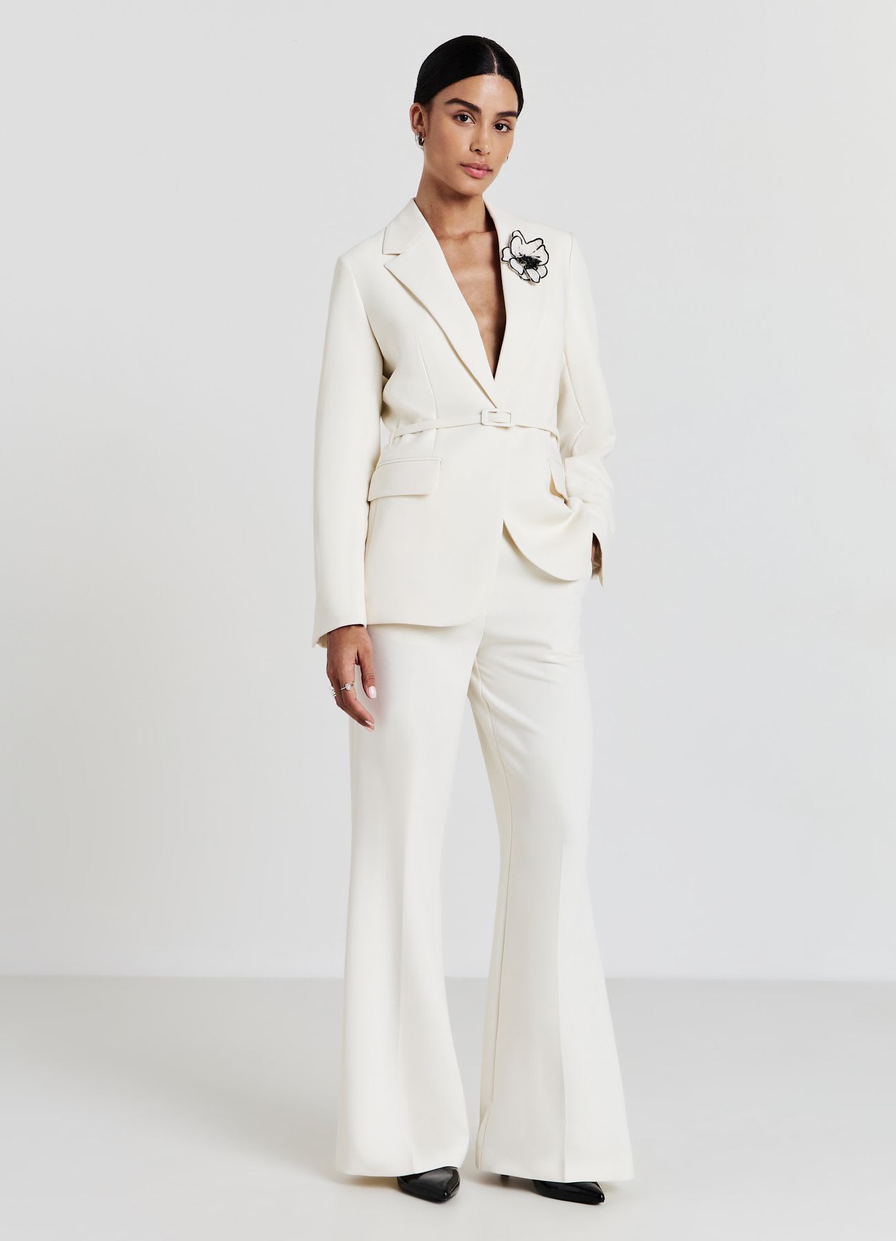Pantaloni zampa con tasche francesi