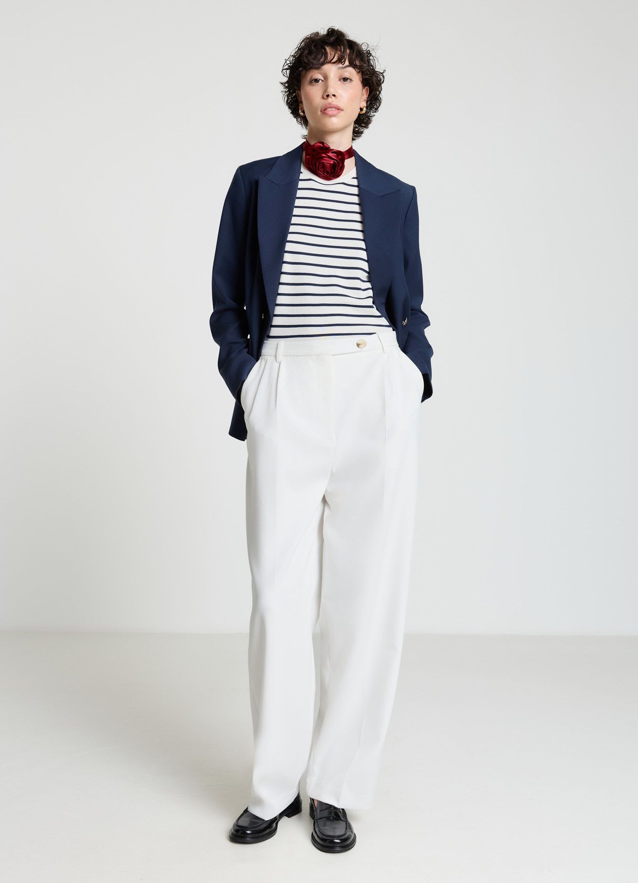 Pantaloni carrot con doppia piega