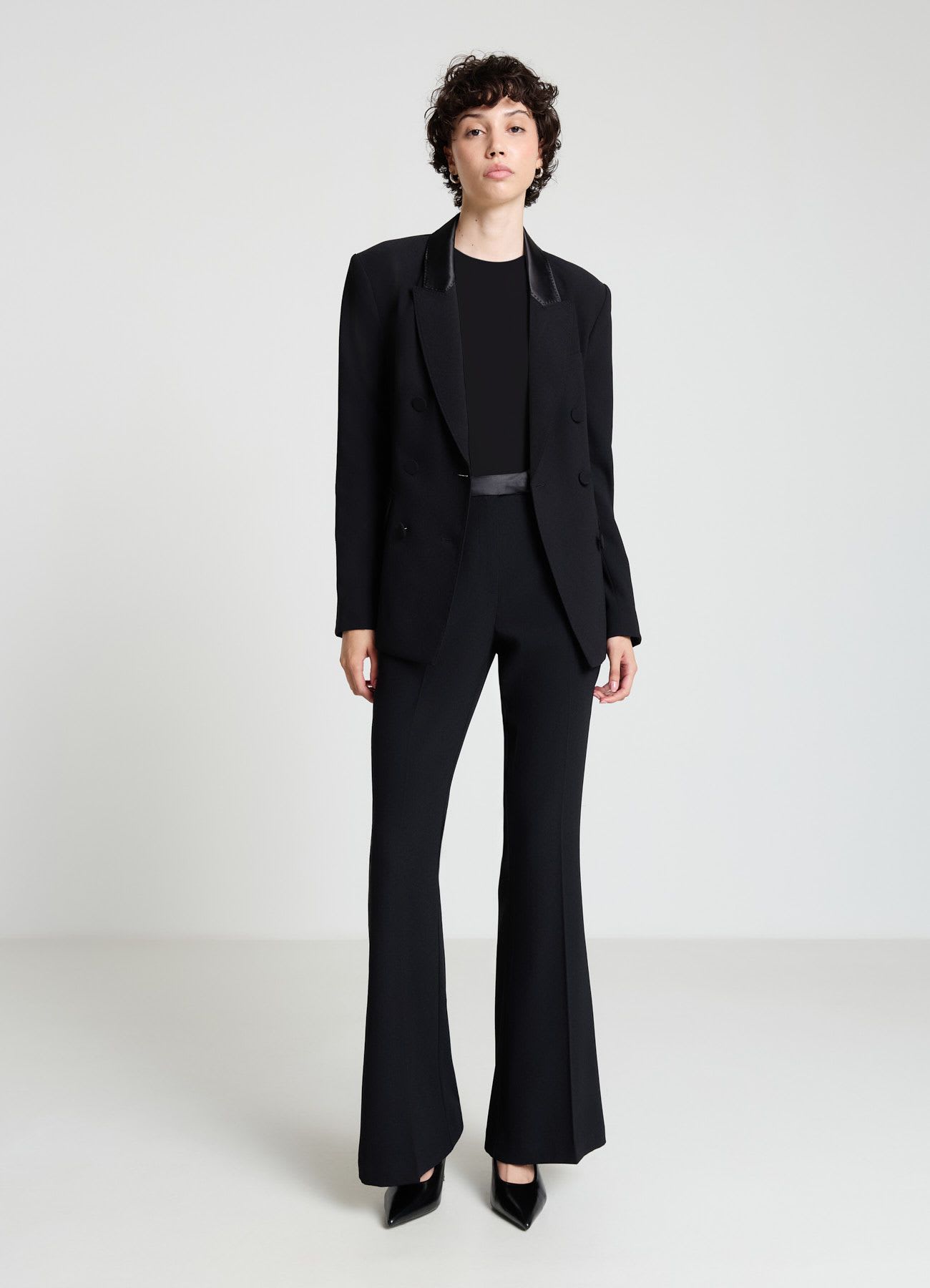 Pantaloni a zampa tessuto crepe