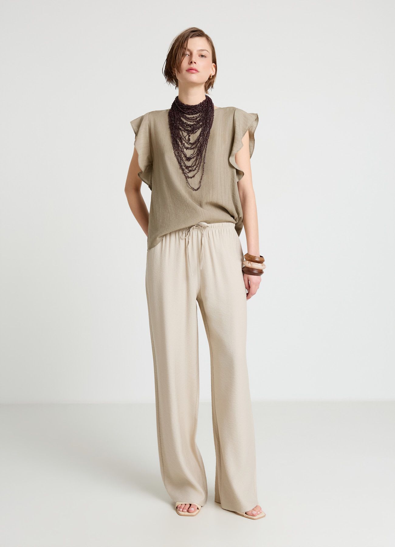 Blusa con maniche a volant