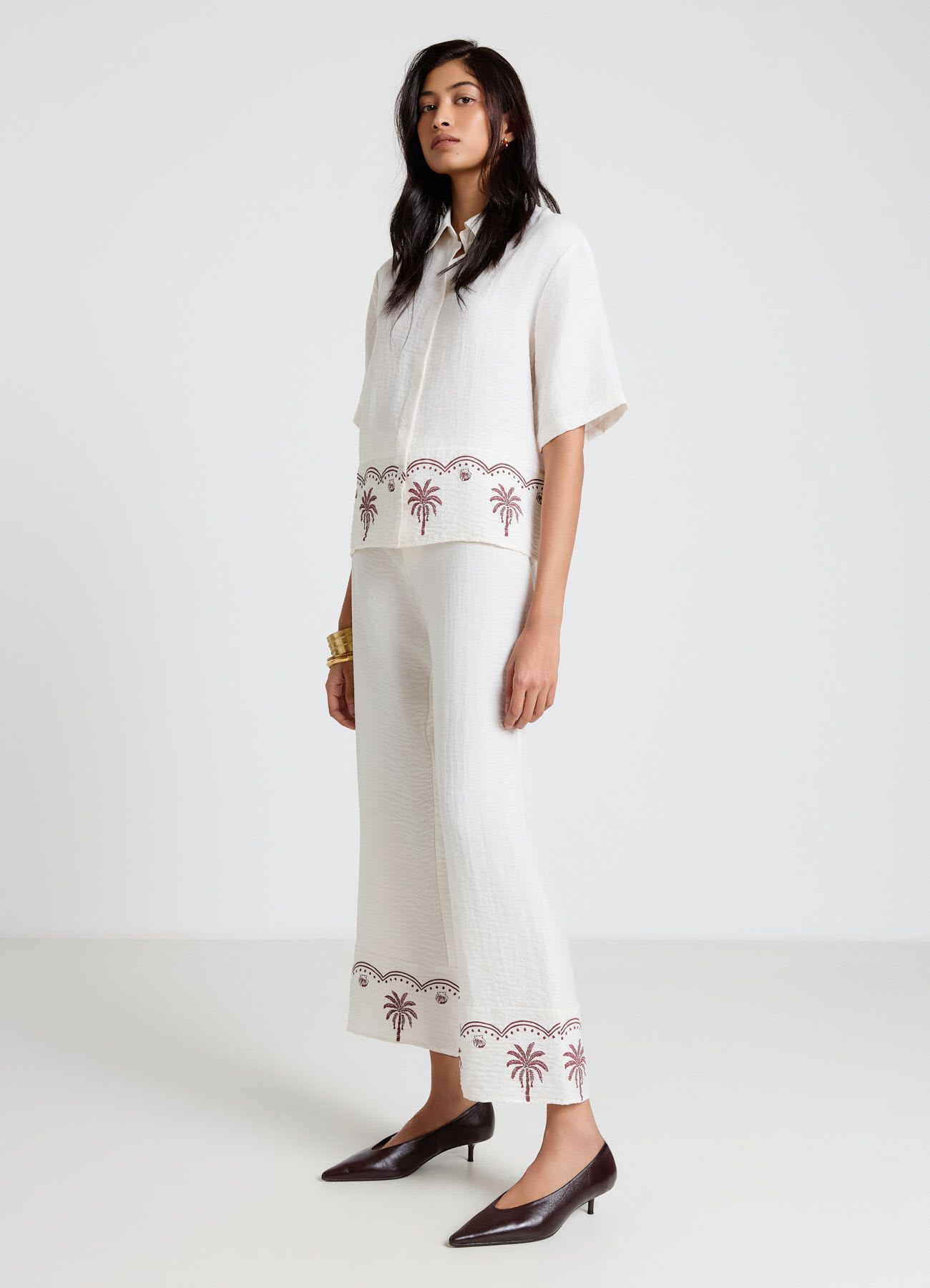 Pantaloni straight con ricamo palme