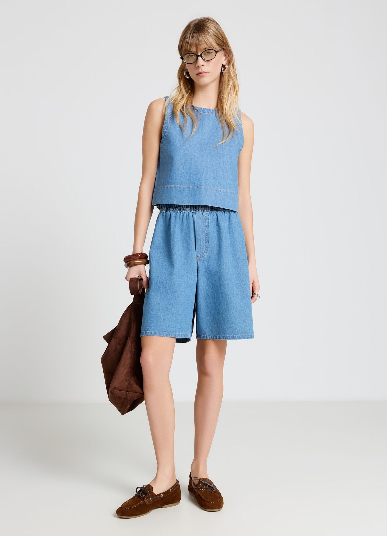 Top in denim con bottoni sul retro