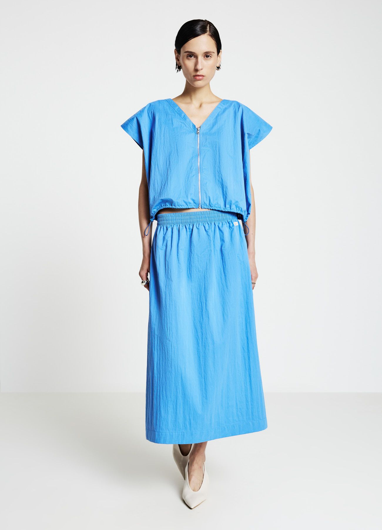 Blusa con zip frontale