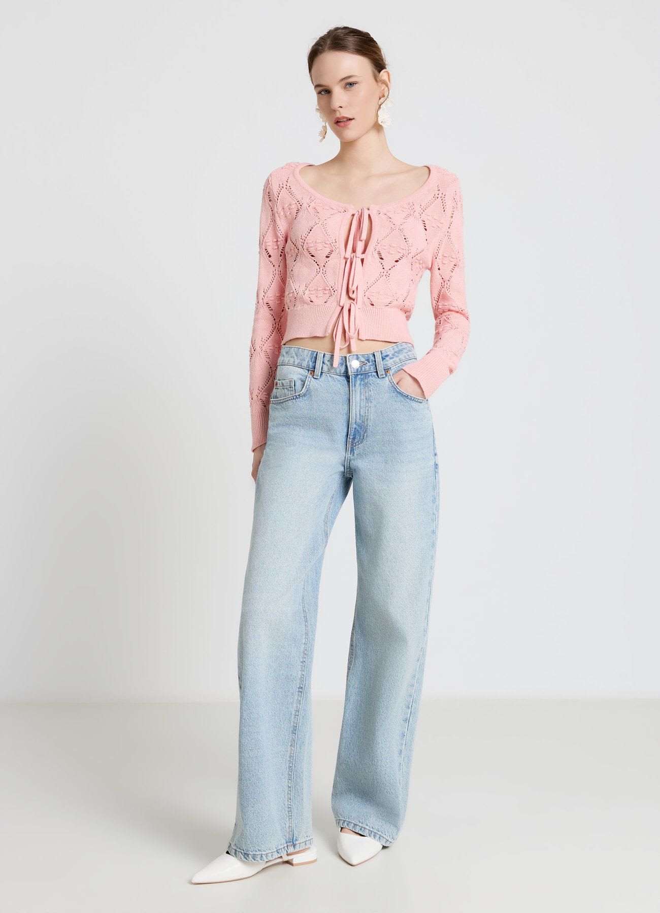 Cardigan traforato con fiocchi