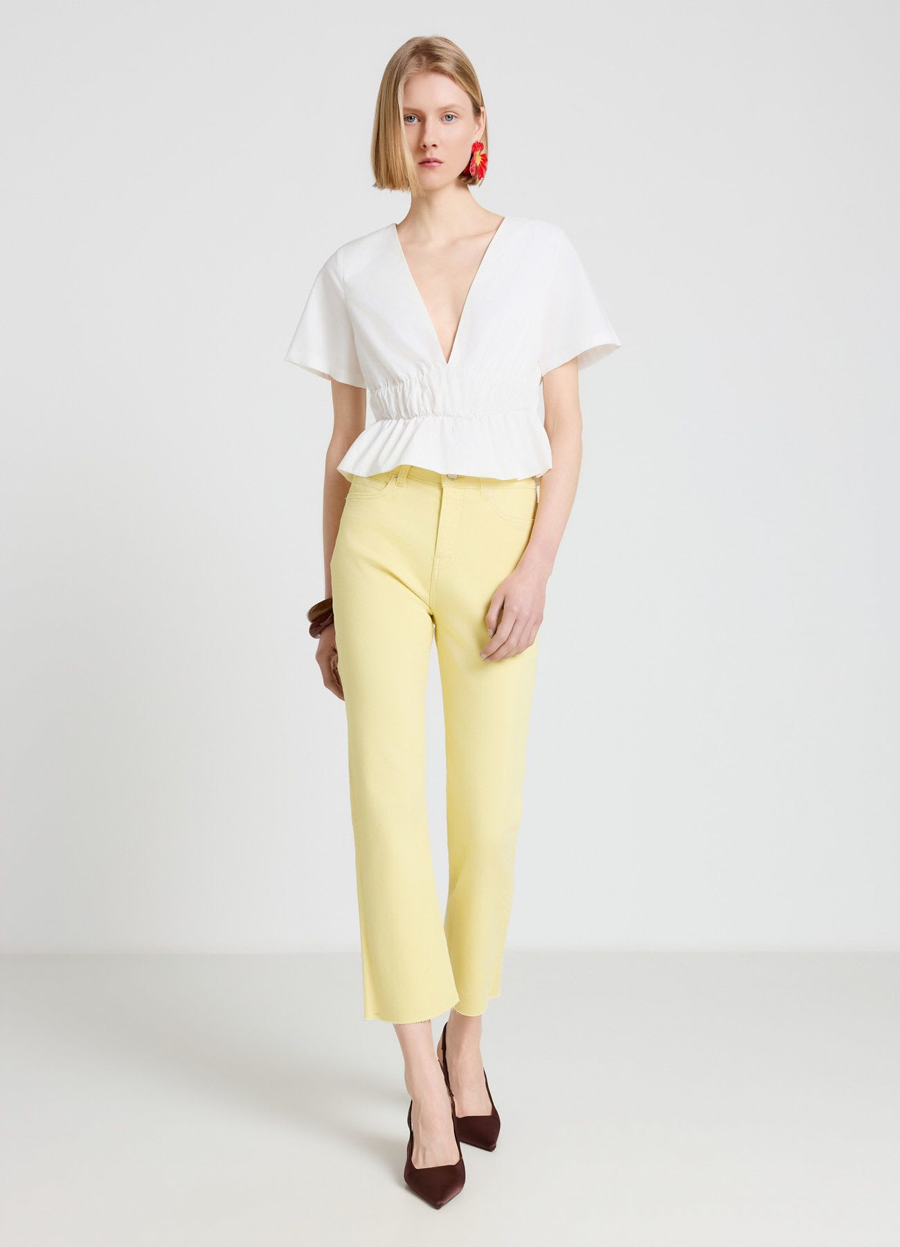 Jeans cropped flare a tinta unita