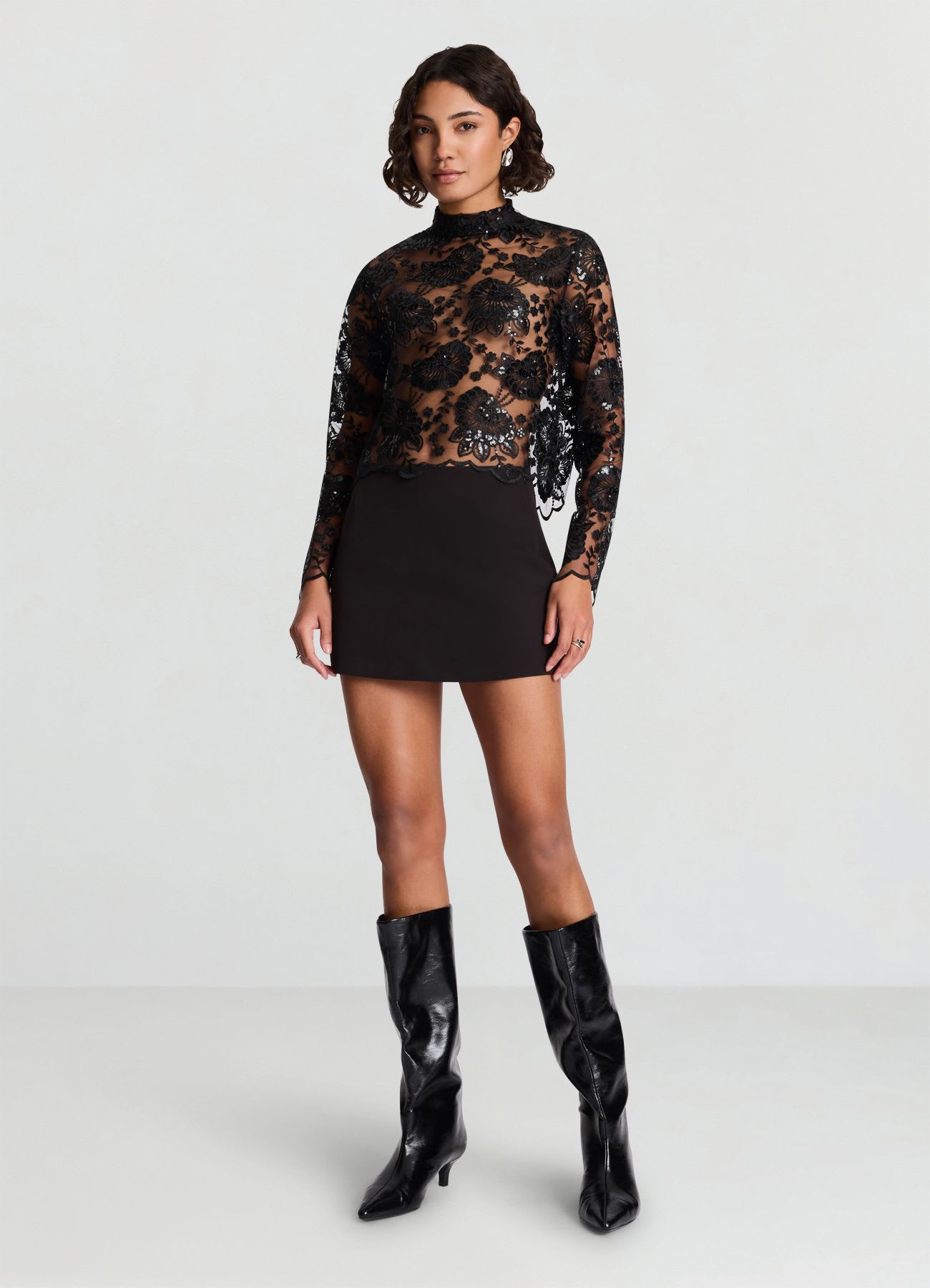 Blusa in pizzo con paillettes