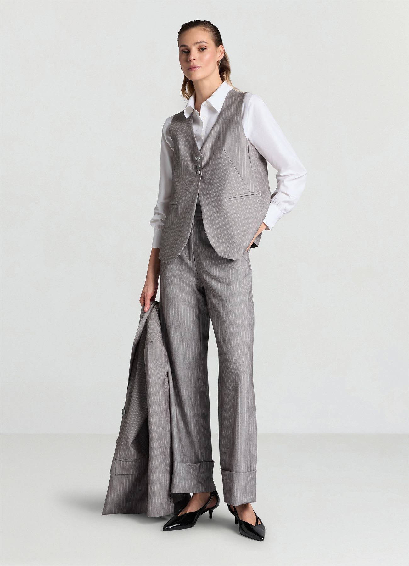 Pantaloni palazzo gessati con risvolto